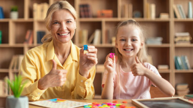 teacher and student smiling