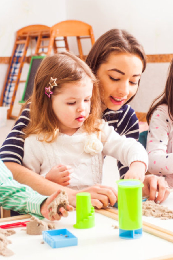 woman play with her students