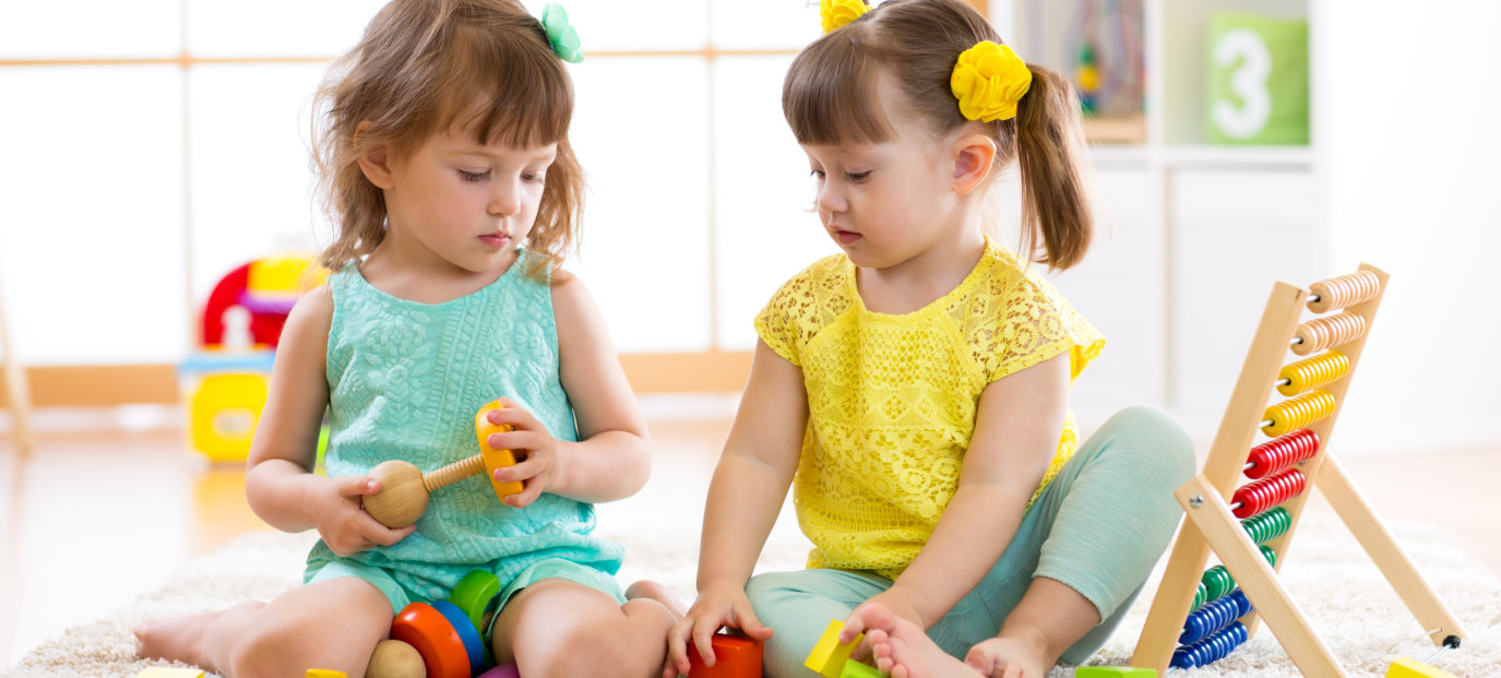 Children playing together with building blocks