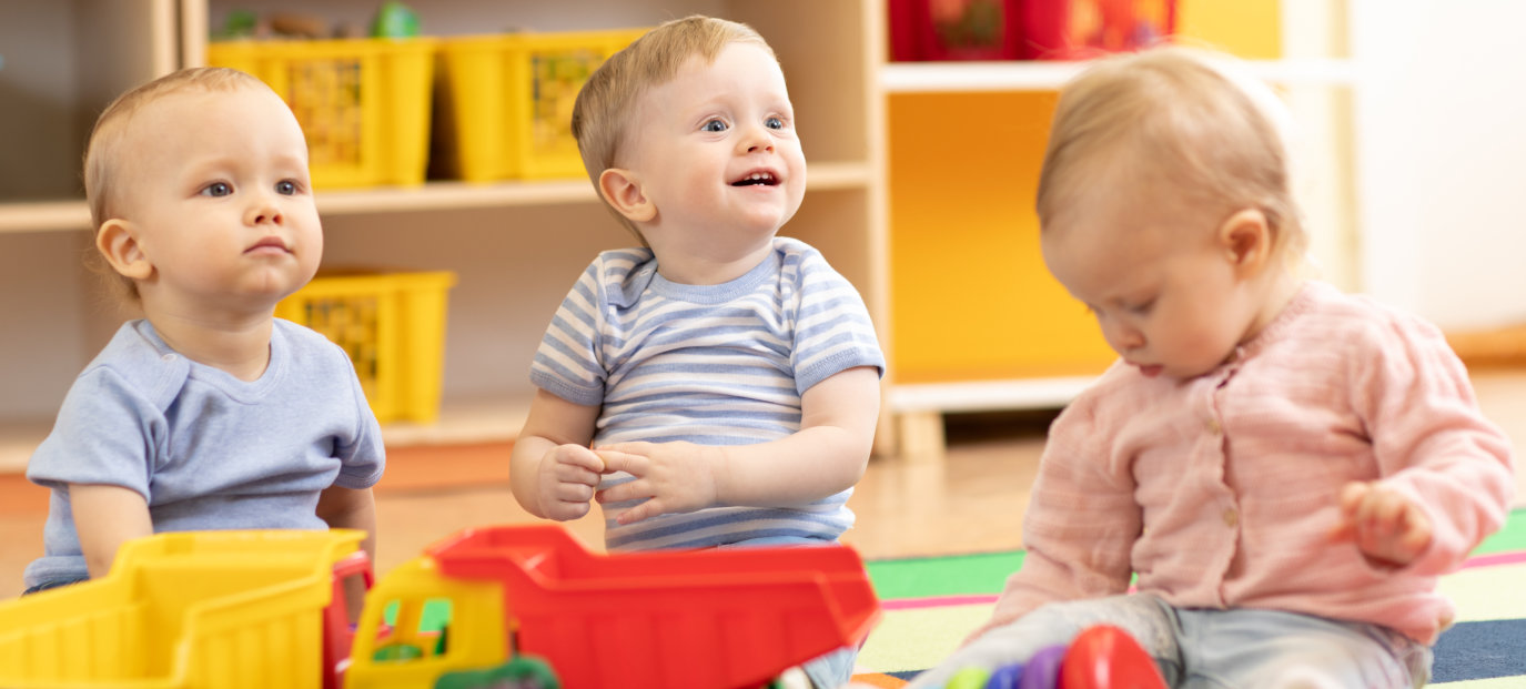 Little toddlers boys and a girl playing together