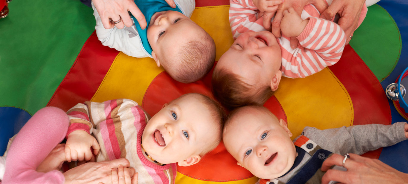 Babies Having Fun At Nursery Playgroup