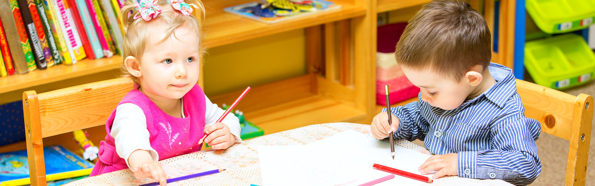 two kids writing